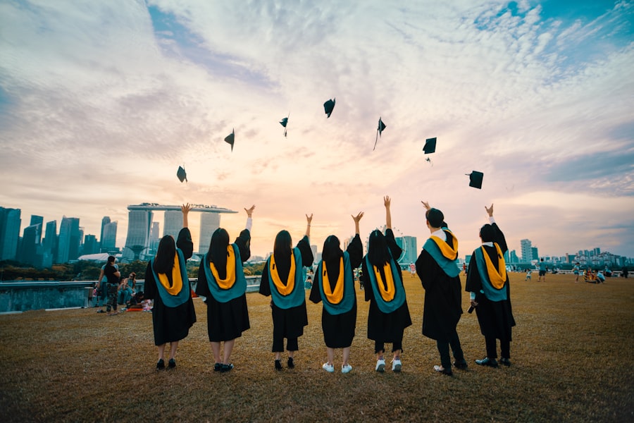 Graduate celebrating outdoors in cap and gown